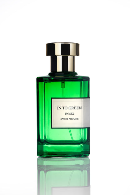Green perfume bottle labeled 'In to Green' on a white background