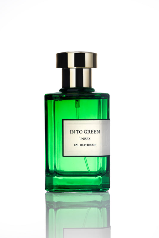 Green perfume bottle labeled 'In to Green' on a white background