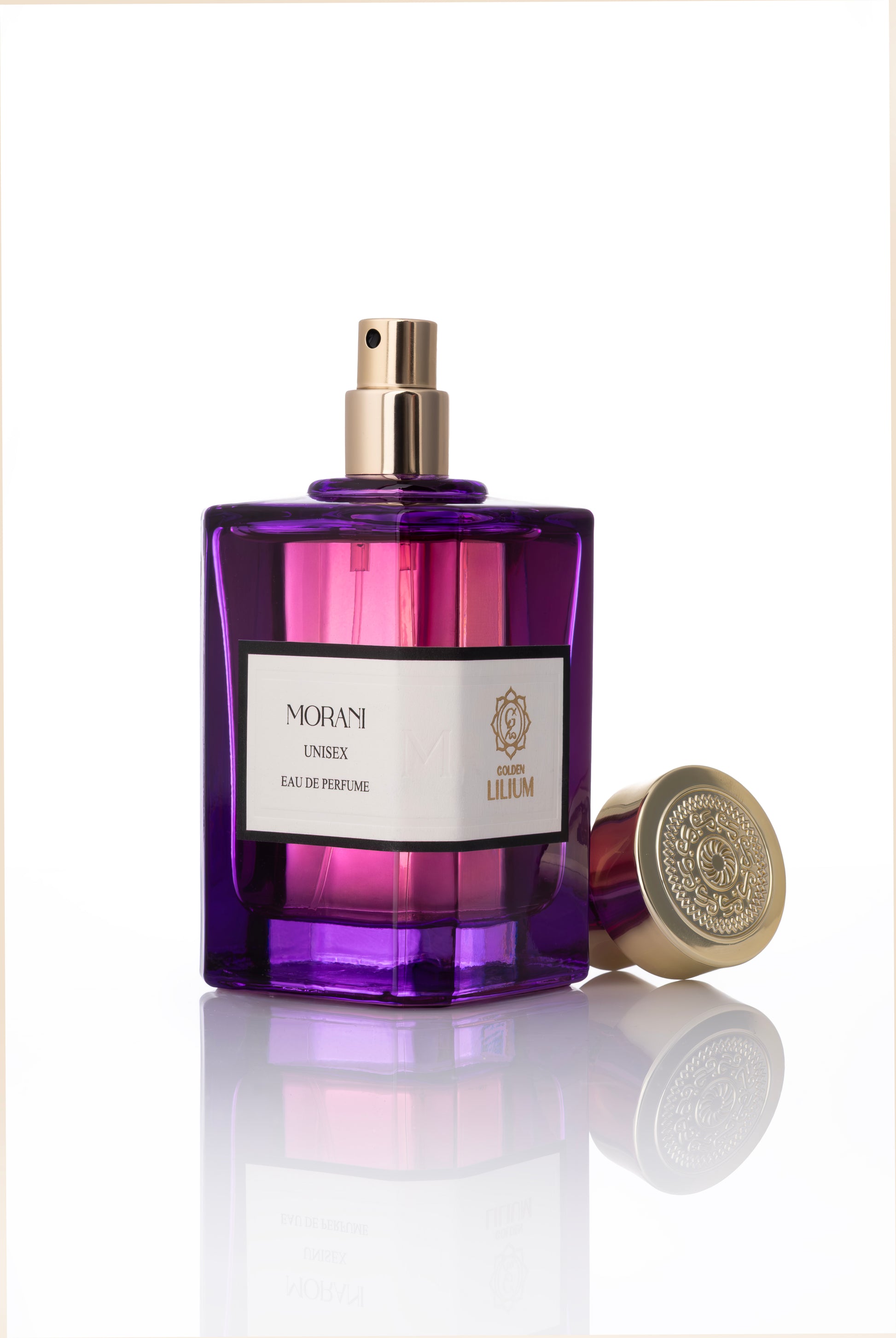 Purple perfume bottle with gold cap on a white background golden lilium morani unisex perfume 100 ml